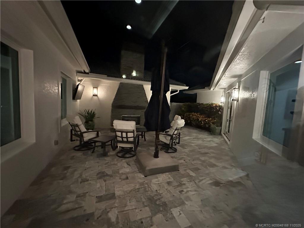 1904 Southeast Sailfish Point Boulevard Stuart, FL 34996 - Photo 48 of 64 a view of living room with a table and chairs