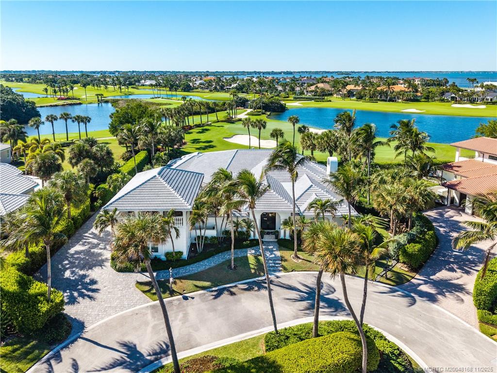 1904 Southeast Sailfish Point Boulevard Stuart, FL 34996 - Photo 54 of 64 an aerial view of residential house with outdoor space and lake view