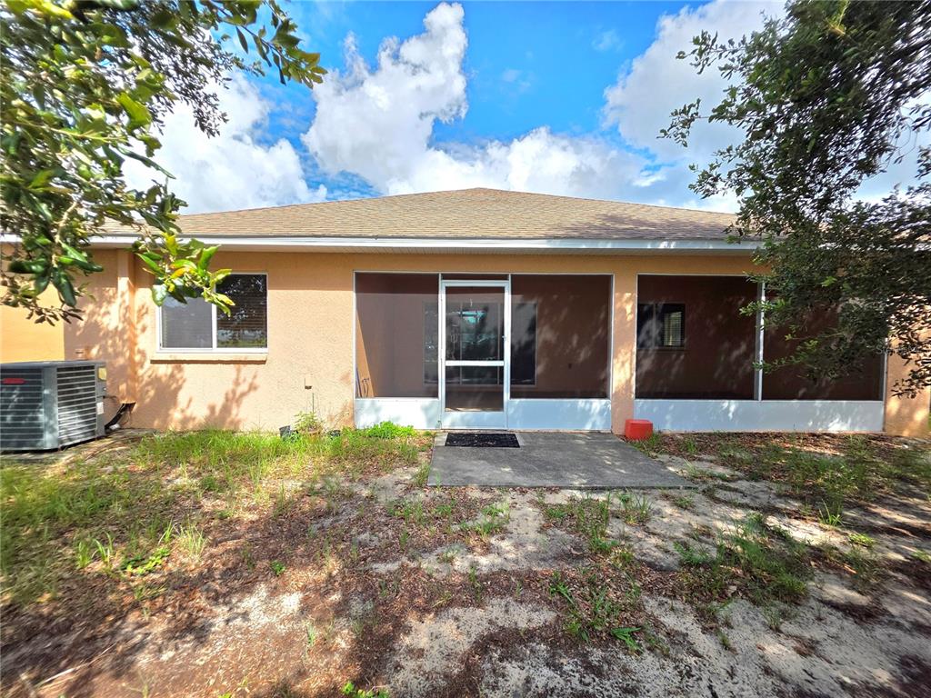 4284 High Ridge Avenue Spring Hill, FL 34609 - Photo 38 of 40 a view of a house with backyard and garden