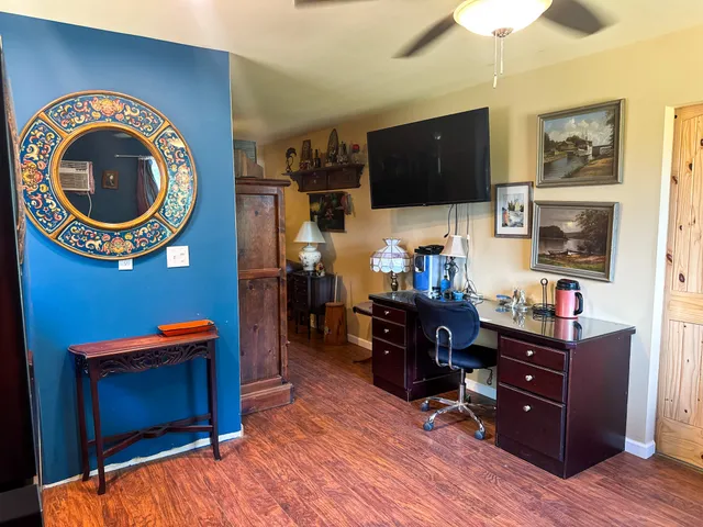 a view of wooden door and a window