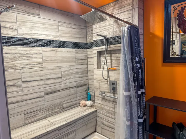 a bathroom with a toilet a sink and a mirror