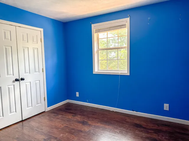 a kitchen with stainless steel appliances granite countertop a wooden floors