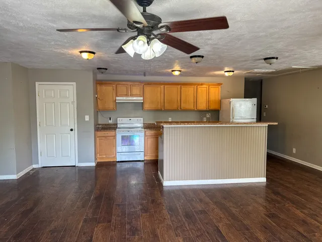 a balcony with wooden floor and fence
