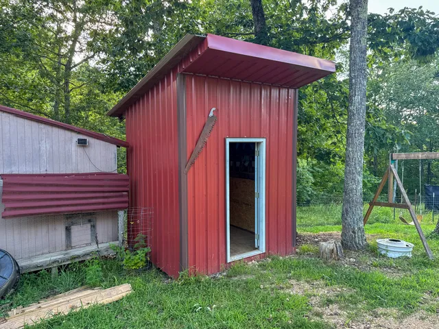 a view of a swimming pool with a yard