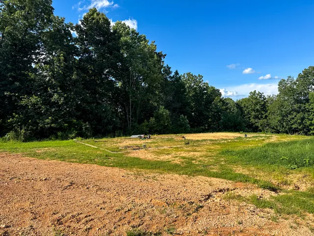 a view of a lake with a yard
