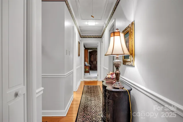 a hallway with a view of living room