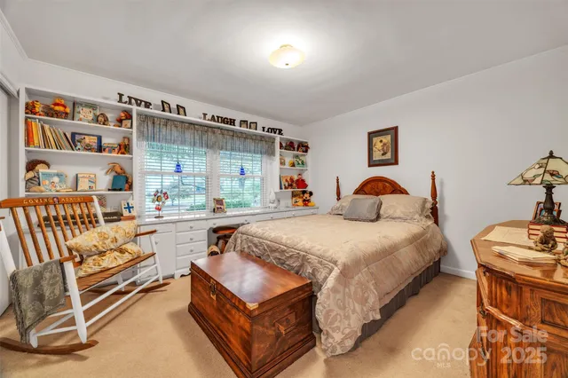 a spacious bedroom with a bed and a couch