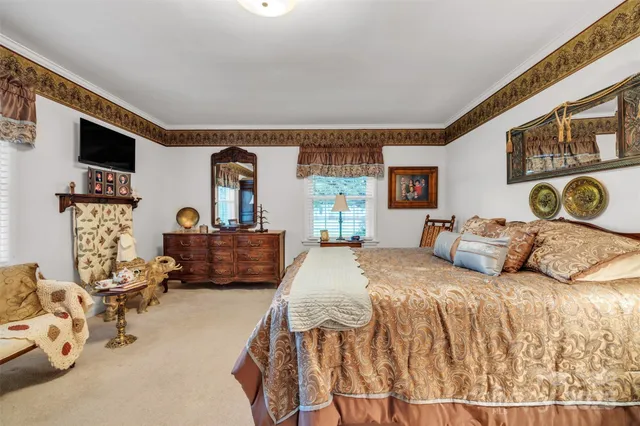 a bedroom with double bed and a large mirror