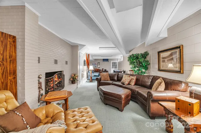 a living room with furniture a couch and a fireplace