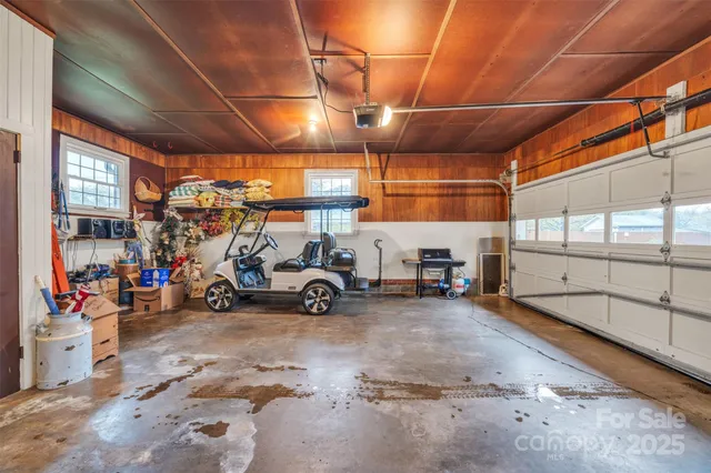a view of a garage with parked cars