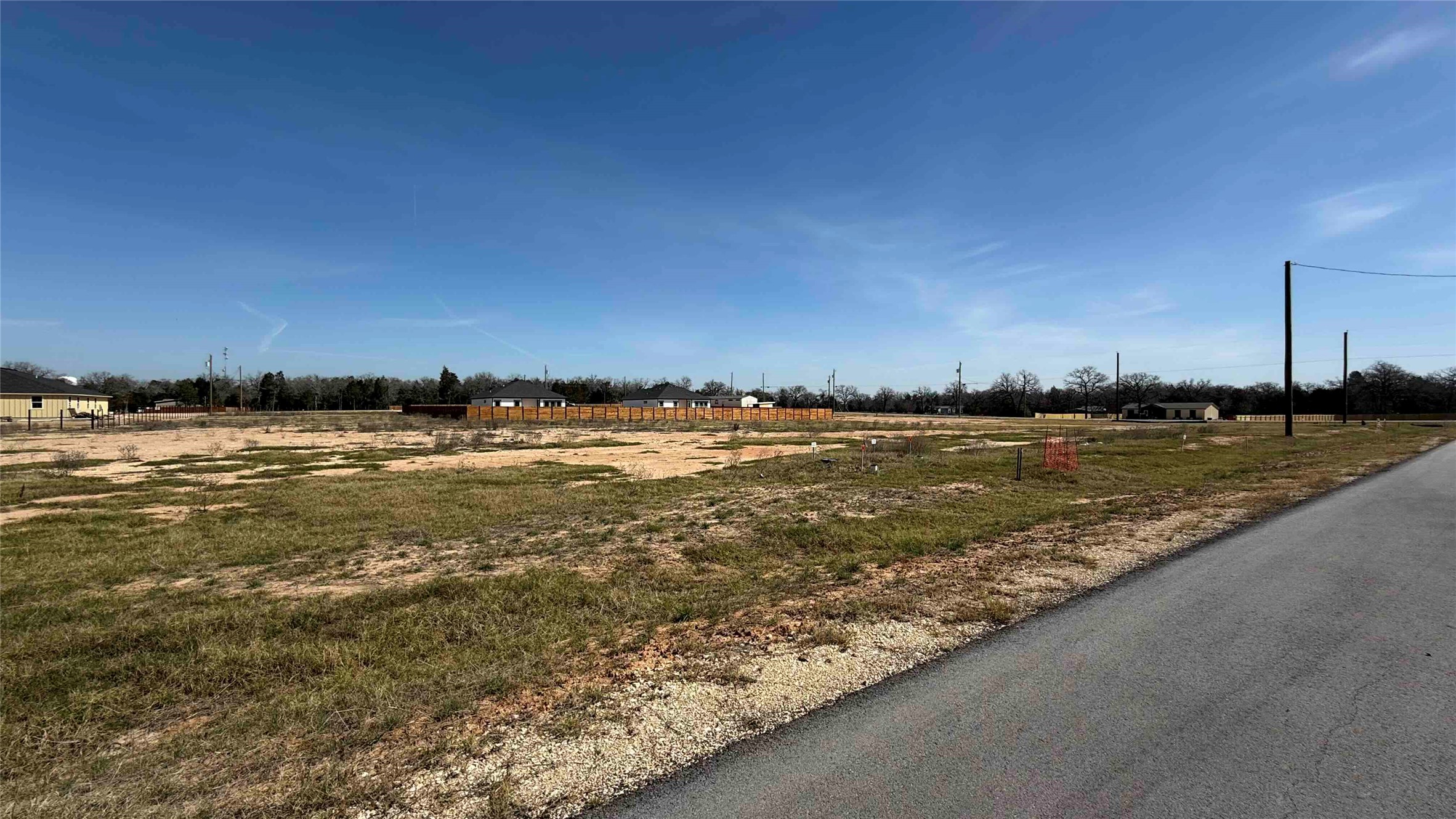a view of a ocean with a building in the background