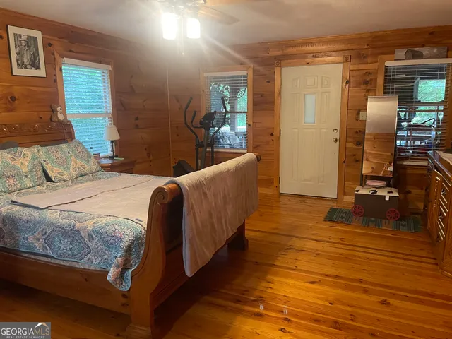 a bedroom with a bed and a table