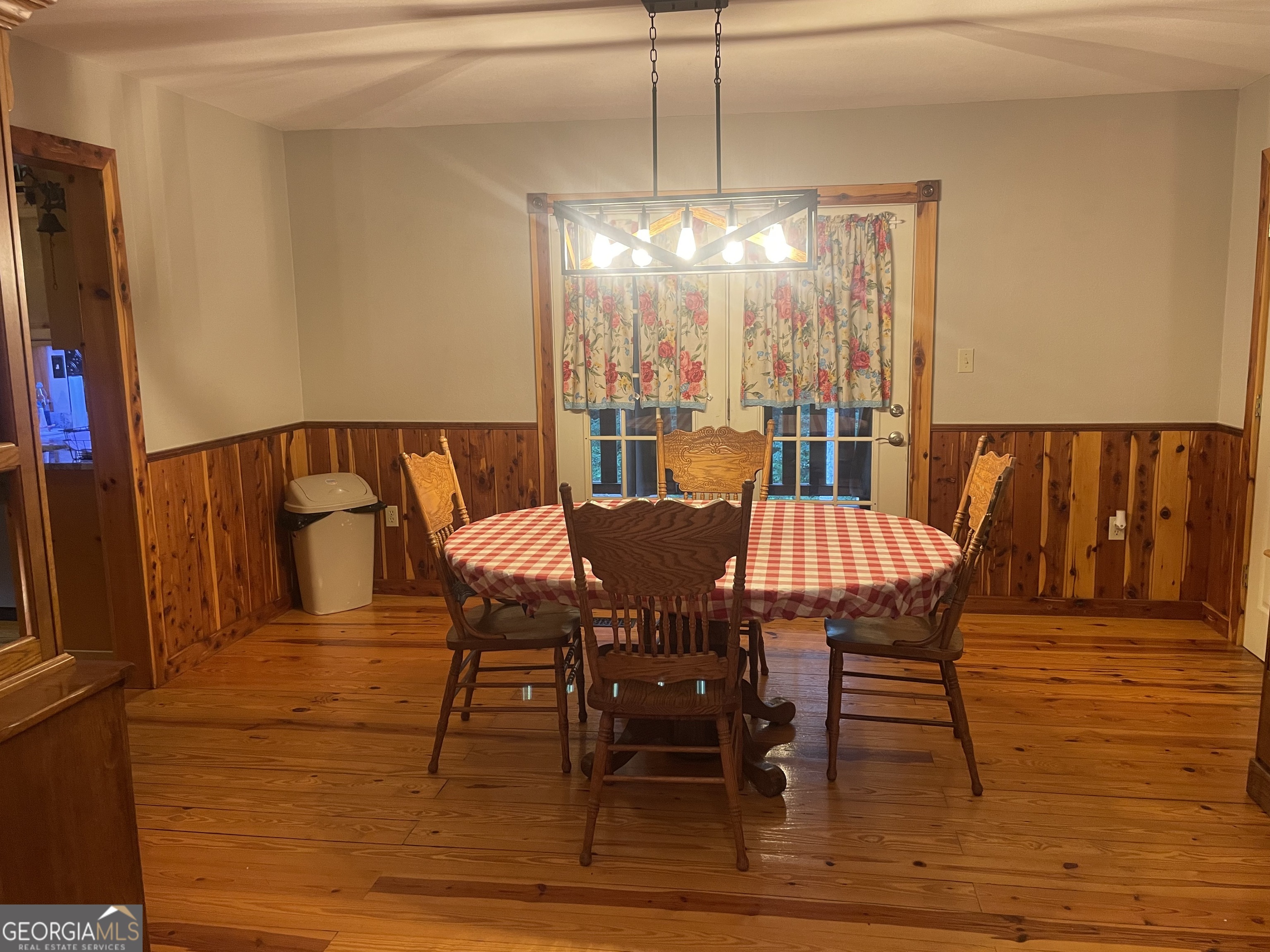 1307 Creasy Patch Road Cornelia, GA 30531 - Photo 21 of 36 a view of a dining room with furniture window and wooden floor