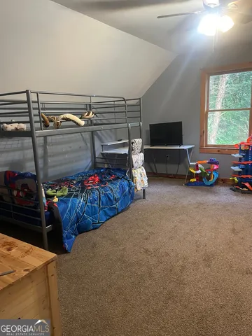 a view of room with closet and toys