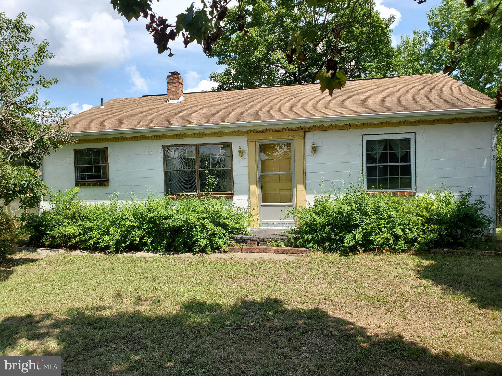 24323 Bagby Road Milford, VA 22514 - Photo 2 of 4 Charming home with lush greenery.