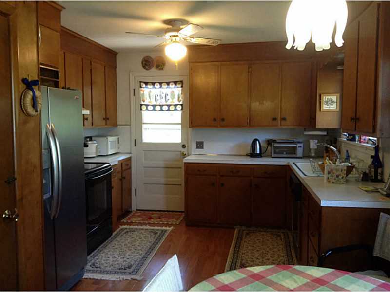 Kitchen. Eat-in kitchen with S/S refrigerator and walk-out to deck