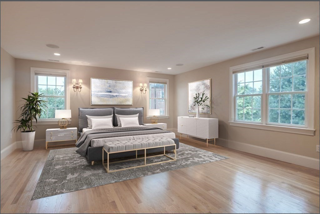 2 A Colonial Drive Arlington, MA 02474 - Photo 15 of 41 a spacious bedroom with a large bed and a couch