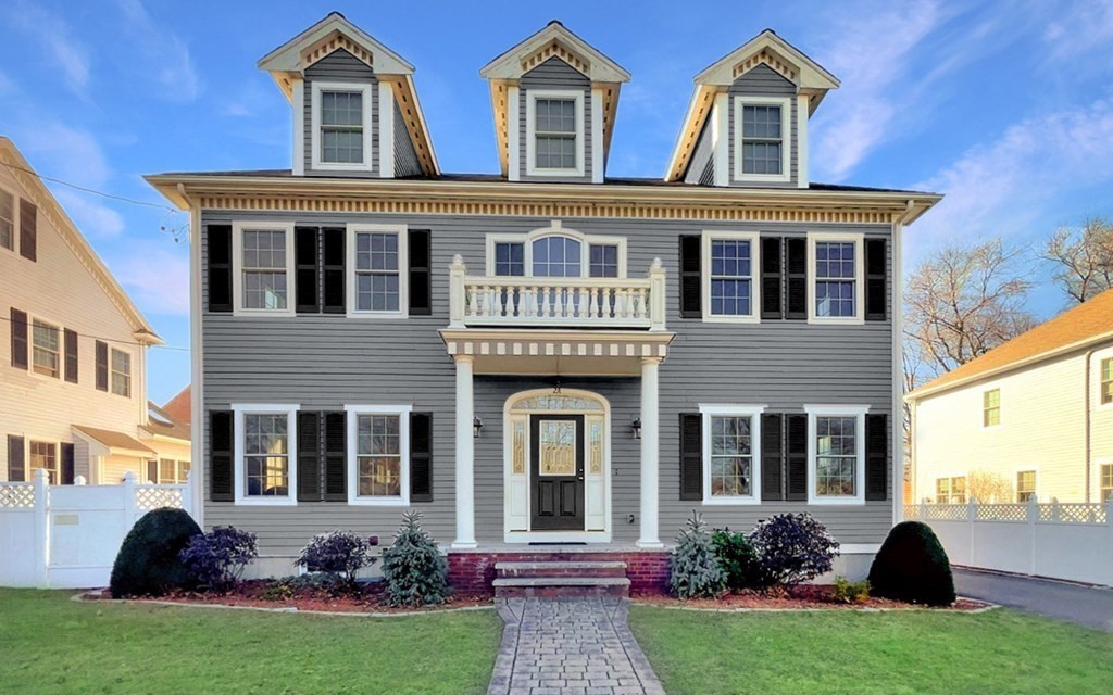 2 A Colonial Drive Arlington, MA 02474 - Photo 32 of 41 a front view of a house with garden and porch