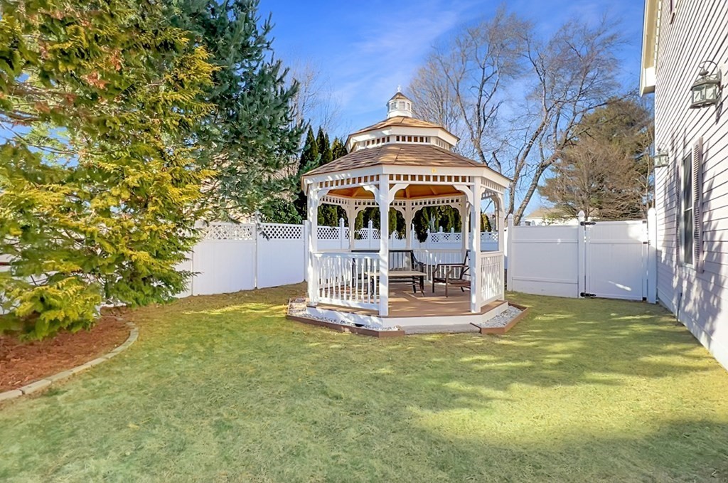 2 A Colonial Drive Arlington, MA 02474 - Photo 35 of 41 a front view of a house with a yard