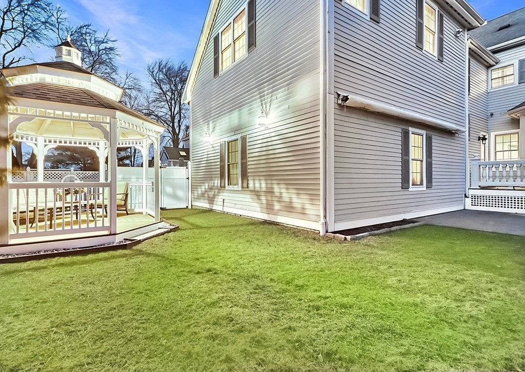 2 A Colonial Drive Arlington, MA 02474 - Photo 37 of 41 a view of a house with a yard and sitting area