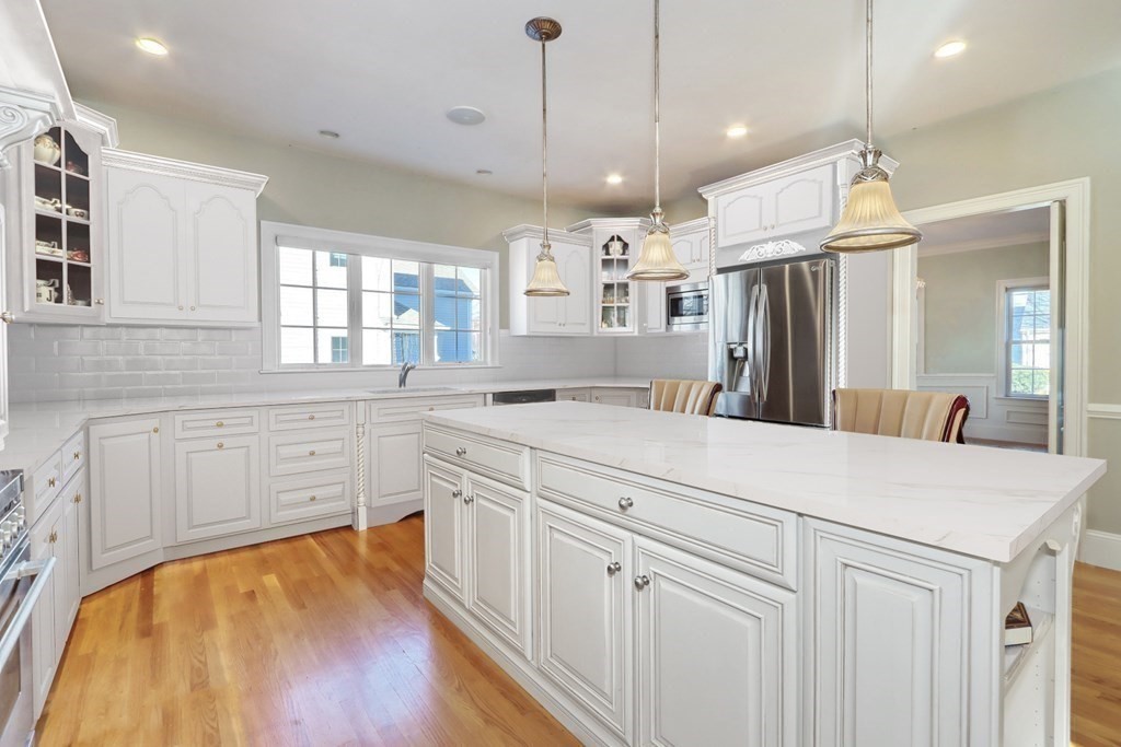 2 A Colonial Drive Arlington, MA 02474 - Photo 4 of 41 a large white kitchen with dishwasher a refrigerator a sink dishwasher and white cabinets with wooden floor