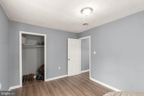 a bathroom with a toilet a sink and a mirror