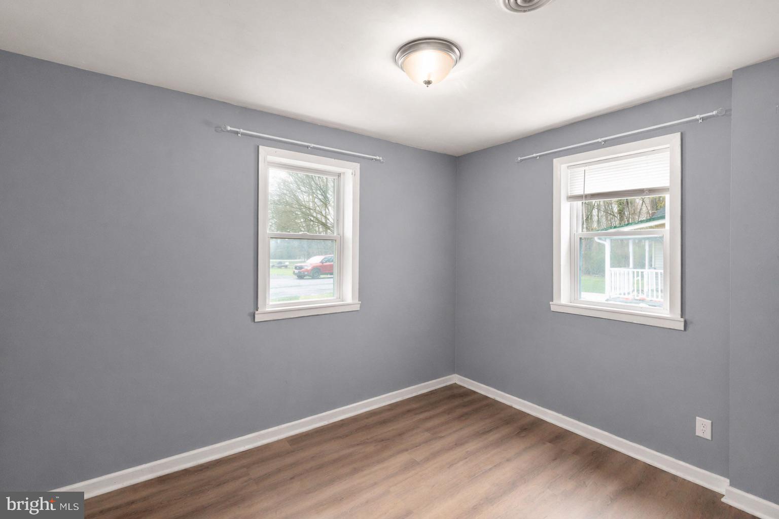 4121 Conowingo Road Darlington, MD 21034 - Photo 21 of 24 a view of an empty room with wooden floor and a window