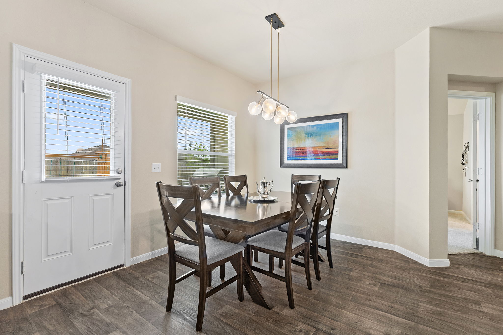 404 Cassandra Drive Hutto, TX 78634 - Photo 14 of 40 Dining area with dark wood-type flooring and suspended lighting