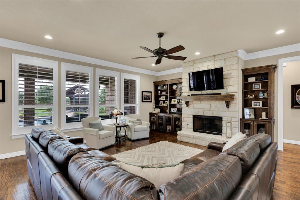 5631 Limestone Lane Midlothian, TX 76065 - Photo 11 of 40 a living room with furniture fireplace and a flat screen tv
