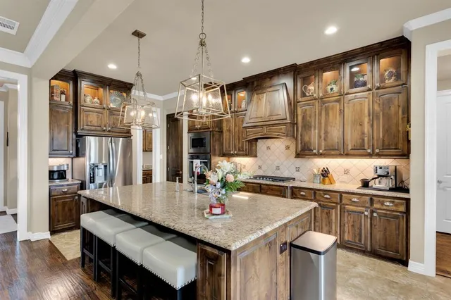a kitchen with counter space cabinets and appliances