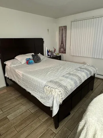 a bedroom with a bed and a closet