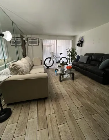 a kitchen with a stove a sink a dining table and chairs