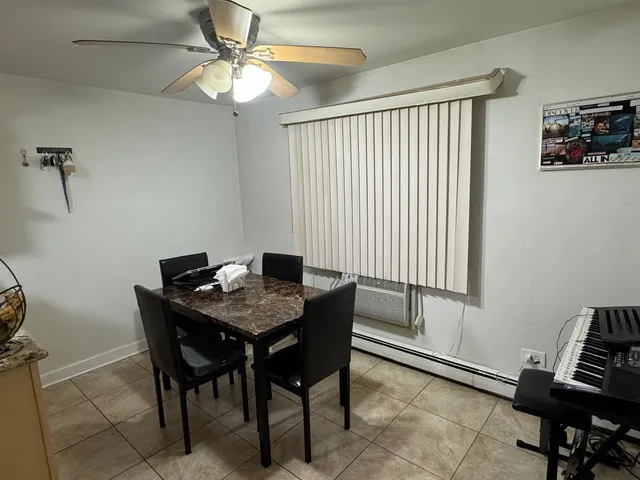 a view of a hallway to a livingroom and a hallway