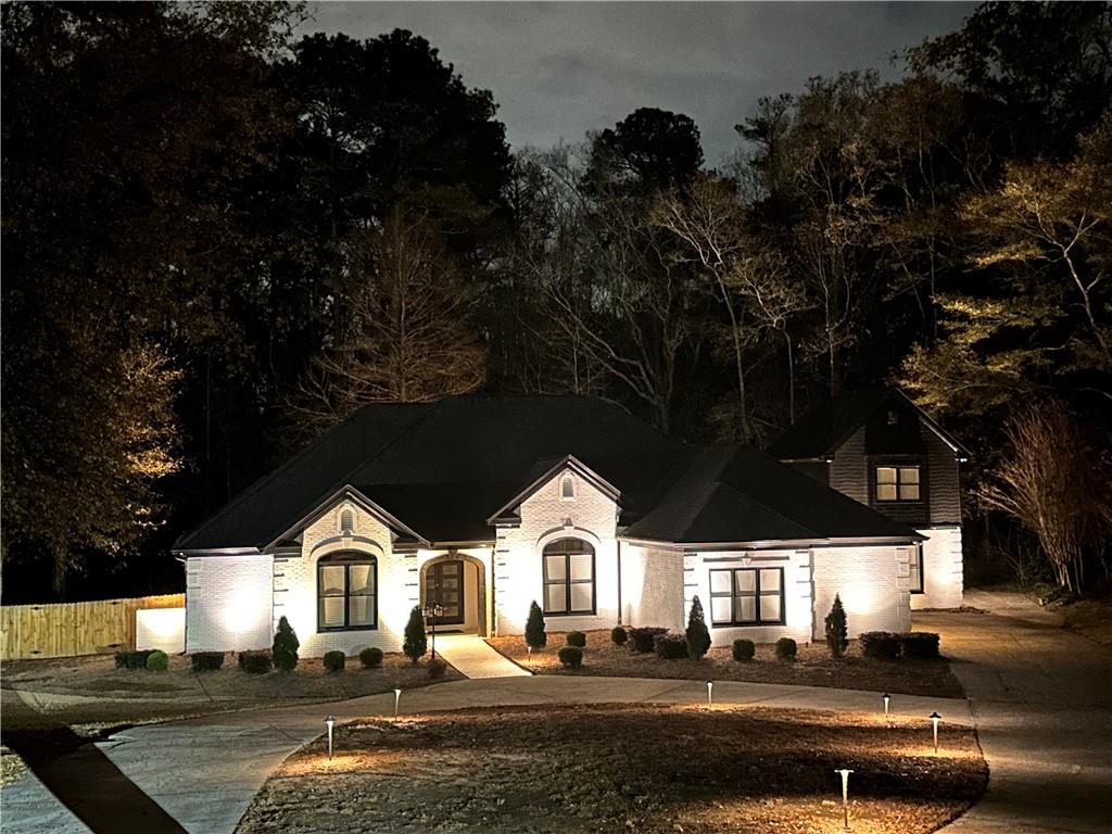 6394 Wood Valley Road Douglasville, GA 30134 - Photo 2 of 84 a front view of a house with garden