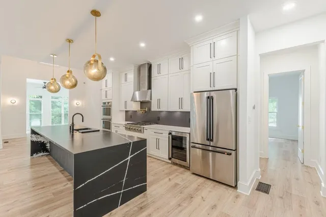 a view of an empty room with a large window