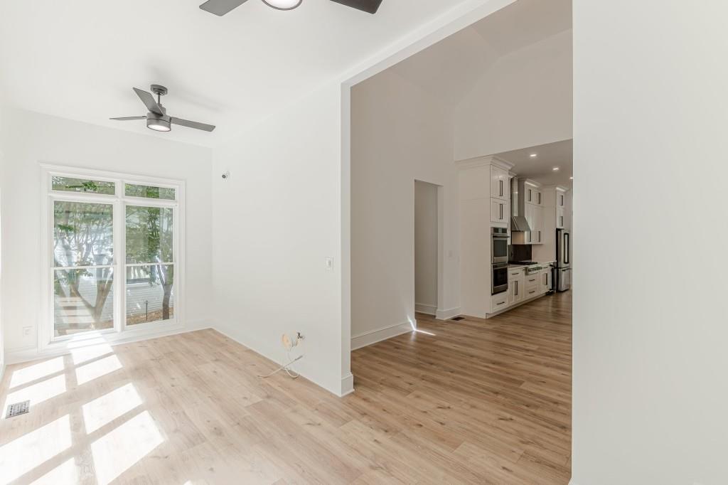 6394 Wood Valley Road Douglasville, GA 30134 - Photo 28 of 84 a view of a hallway with wooden floor and a living room