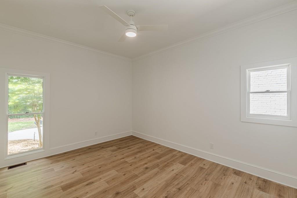 6394 Wood Valley Road Douglasville, GA 30134 - Photo 32 of 84 an empty room with wooden floor and windows