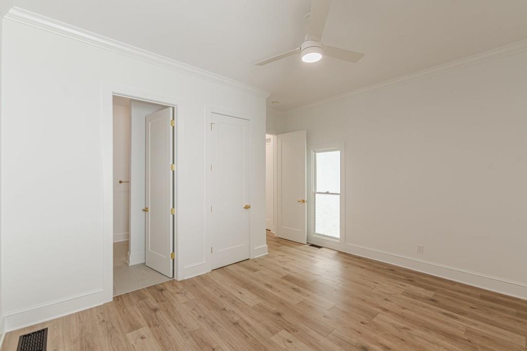 6394 Wood Valley Road Douglasville, GA 30134 - Photo 33 of 84 an empty room with wooden floor and window