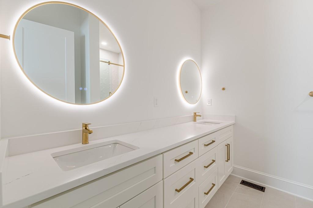 6394 Wood Valley Road Douglasville, GA 30134 - Photo 35 of 84 a bathroom with a sink and a mirror