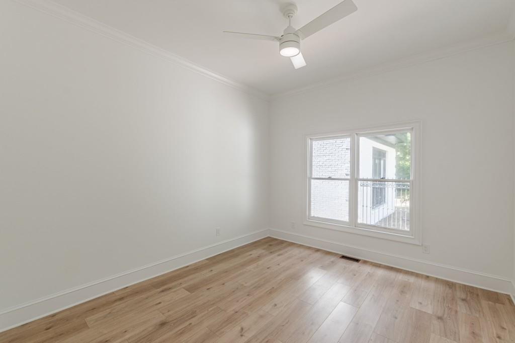 6394 Wood Valley Road Douglasville, GA 30134 - Photo 37 of 84 an empty room with wooden floor and windows