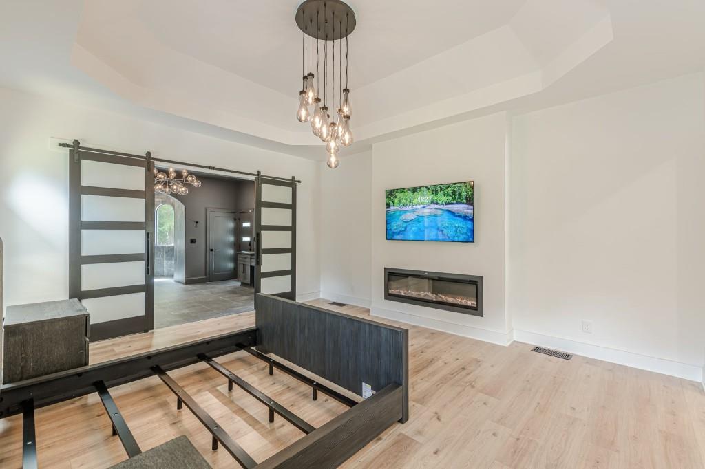 6394 Wood Valley Road Douglasville, GA 30134 - Photo 46 of 84 a living room with furniture and a fireplace
