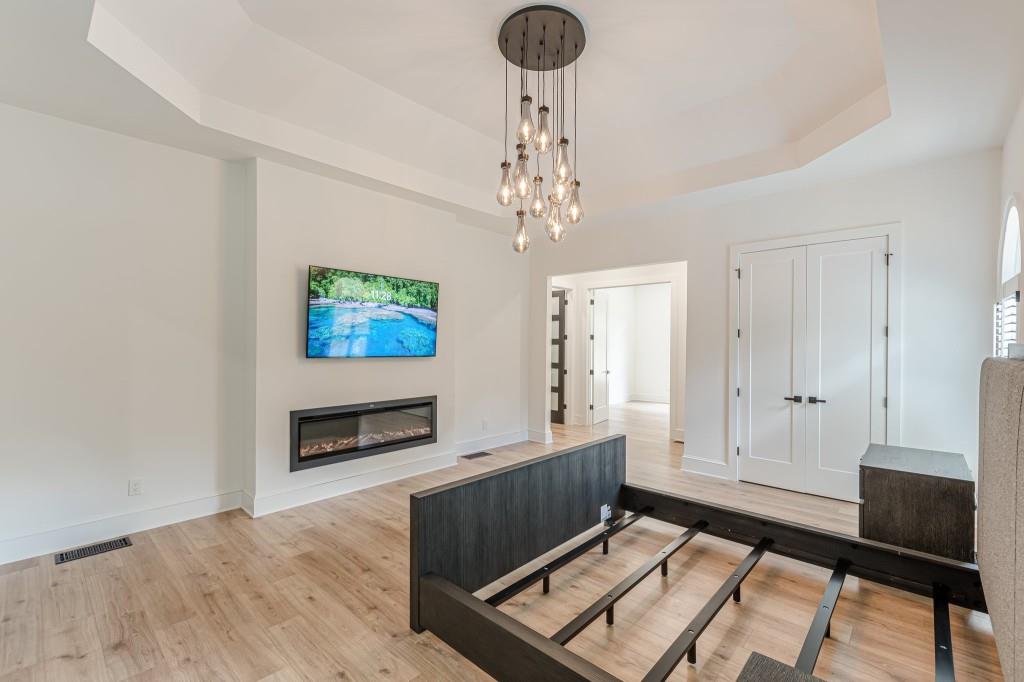 6394 Wood Valley Road Douglasville, GA 30134 - Photo 48 of 84 a living room with furniture and a flat screen tv