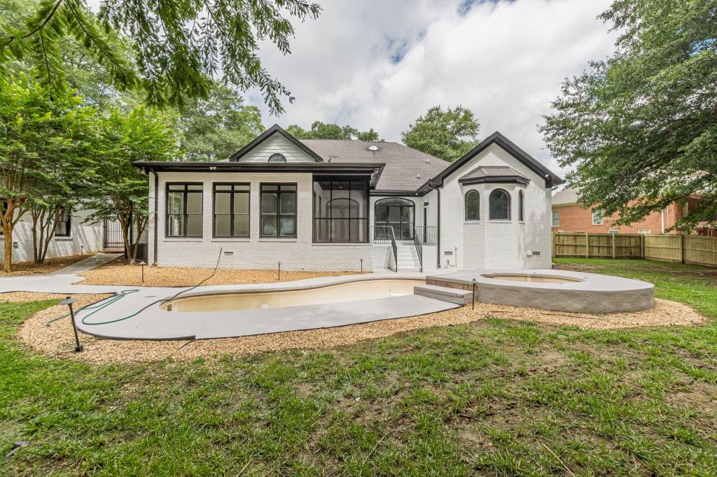 6394 Wood Valley Road Douglasville, GA 30134 - Photo 60 of 84 a view of a house with a yard and palm trees