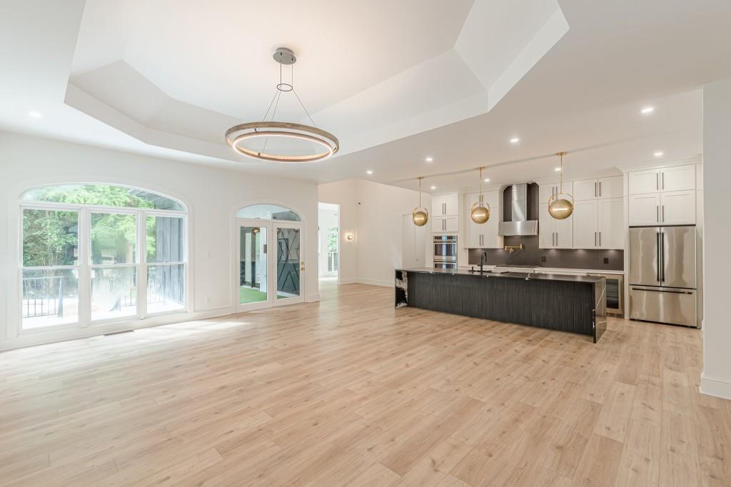 6394 Wood Valley Road Douglasville, GA 30134 - Photo 8 of 84 a large room with a large window and stainless steel appliances