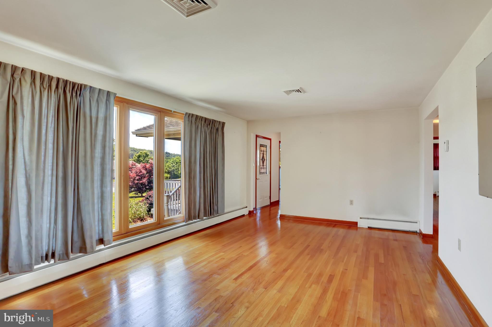 109 Ridgeview Drive Lewistown, PA 17044 - Photo 12 of 40 wooden floor in an empty room with a window