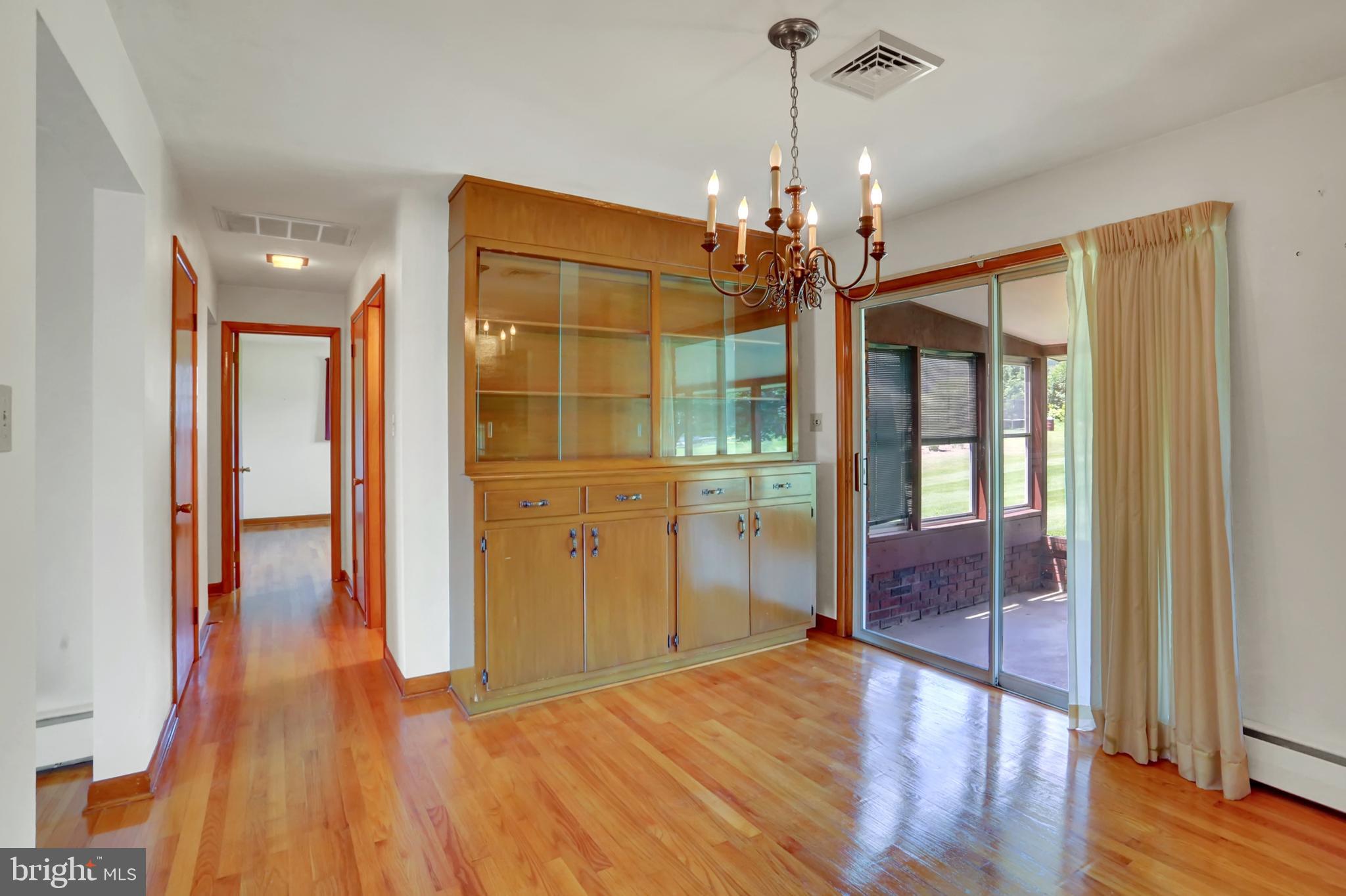 109 Ridgeview Drive Lewistown, PA 17044 - Photo 13 of 40 a very nice looking room with wooden floor and a chandelier