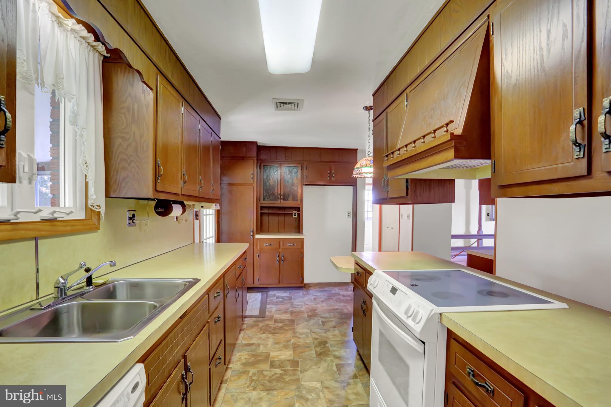 109 Ridgeview Drive Lewistown, PA 17044 - Photo 14 of 40 a kitchen with a sink stove and refrigerator