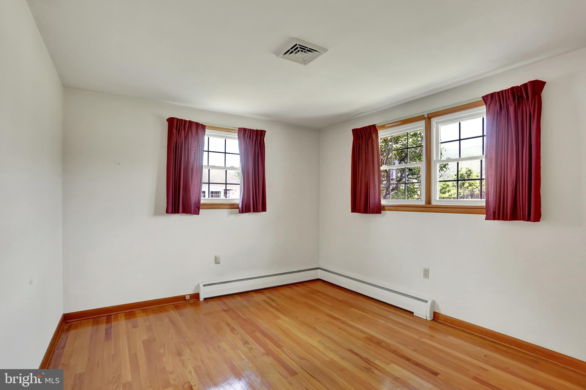 109 Ridgeview Drive Lewistown, PA 17044 - Photo 26 of 40 a view of an empty room with wooden floor and a window
