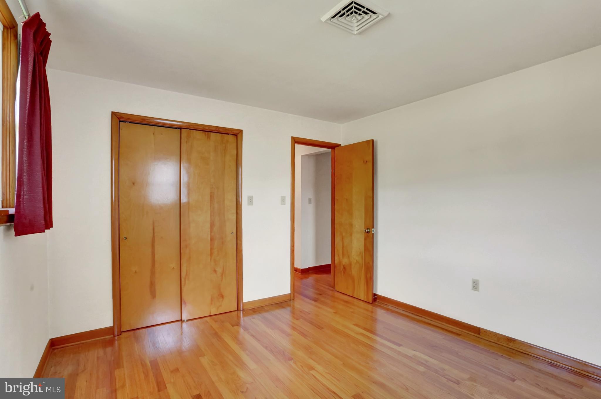 109 Ridgeview Drive Lewistown, PA 17044 - Photo 27 of 40 a view of an empty room with wooden floor and a window