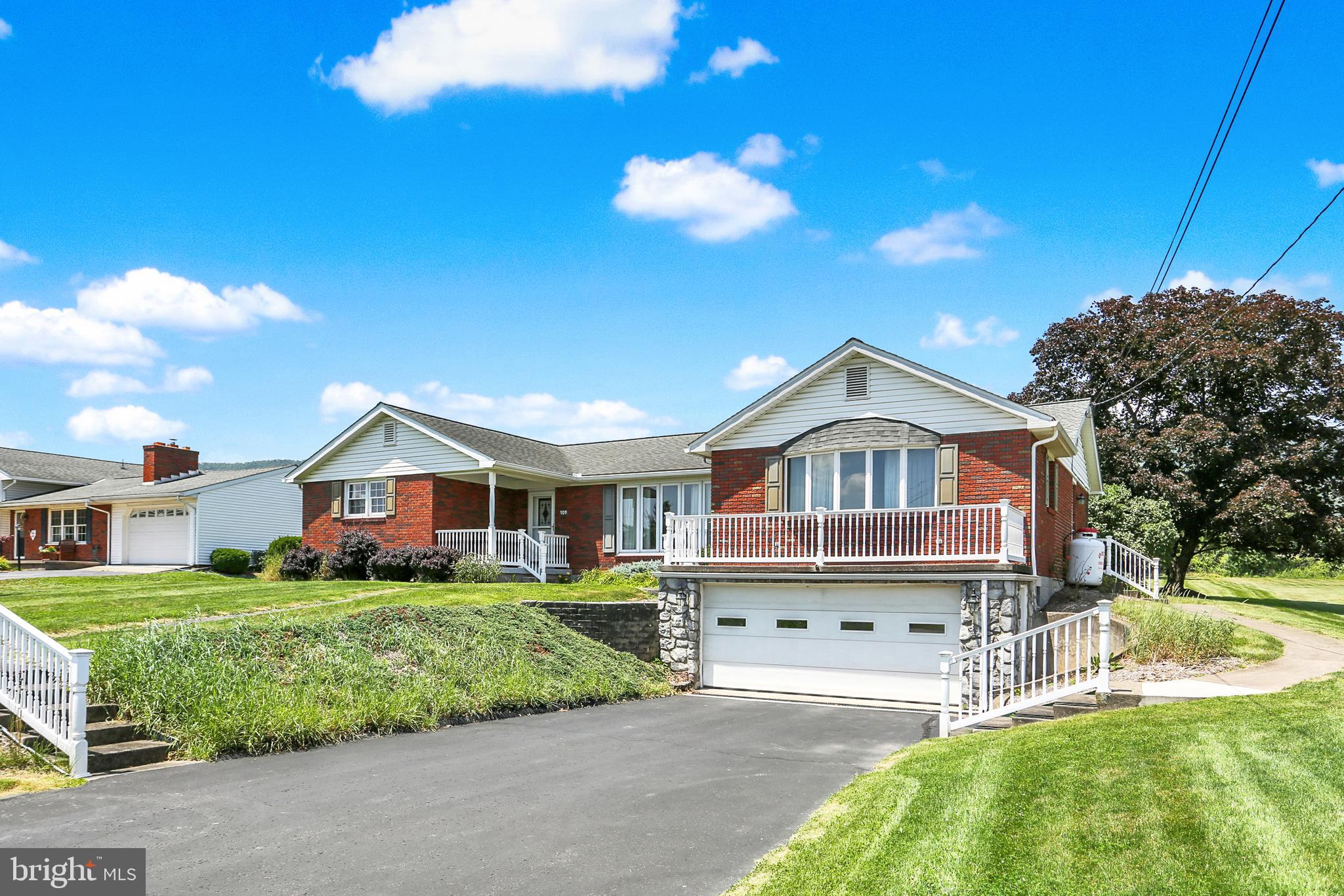 109 Ridgeview Drive Lewistown, PA 17044 - Photo 3 of 40 a front view of a house with a garden and plants